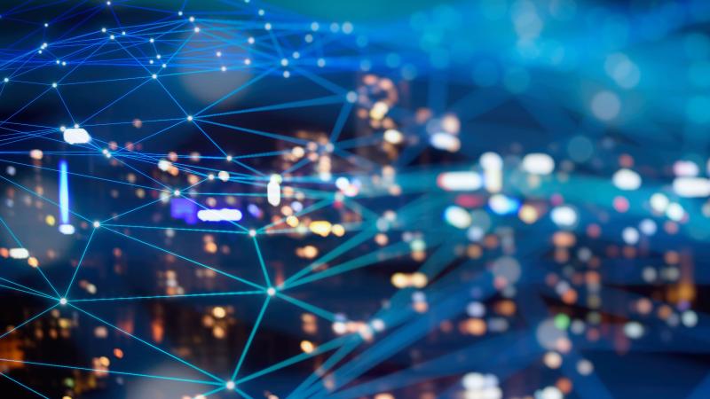 Photo of data web overlaid on city skyline